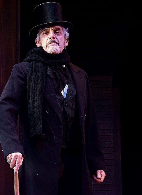 The actor Carl  Walnau as Scrooge, proud, haughty, severe-looing.